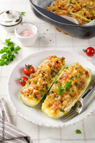 Zucchini stuffed with minced meat and tomatoes and cheese.