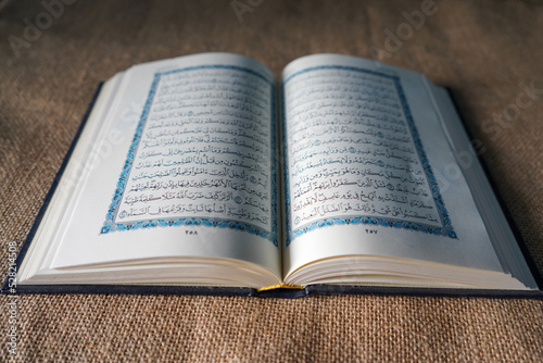 Bilde på lerret Indonesia - July, 2022 : The Quran, also romanized Qur'an or Koran, is central religious text of Islam, believed by Muslims to revelation from God (Allah)