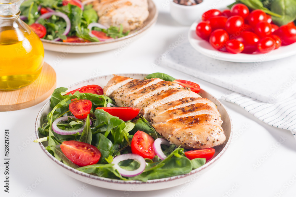 Salad with grilled chicken fillet meat, fresh vegetables, spinach, ruccola, red onion and tomato. Healthy menu. Diet food. Top view. Banner 