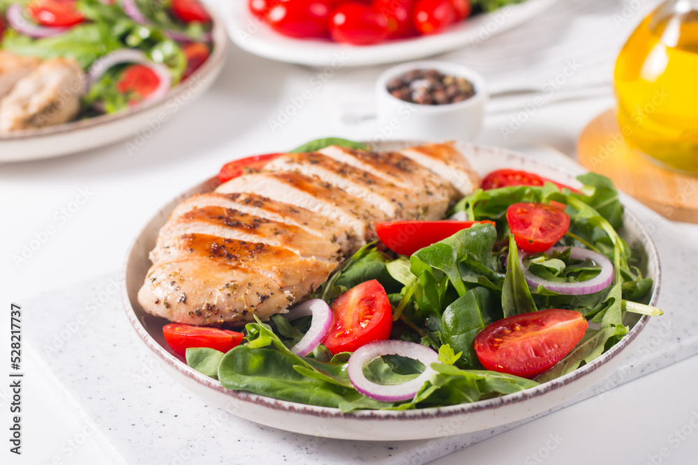 Salad with grilled chicken fillet meat, fresh vegetables, spinach, ruccola, red onion and tomato. Healthy menu. Diet food. Top view. Banner 