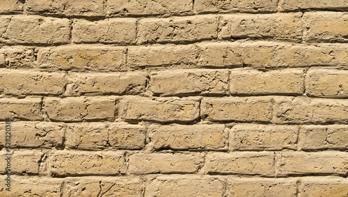 Old adobe bricks wall made of mud.Useful for backgrounds and texture. photo
