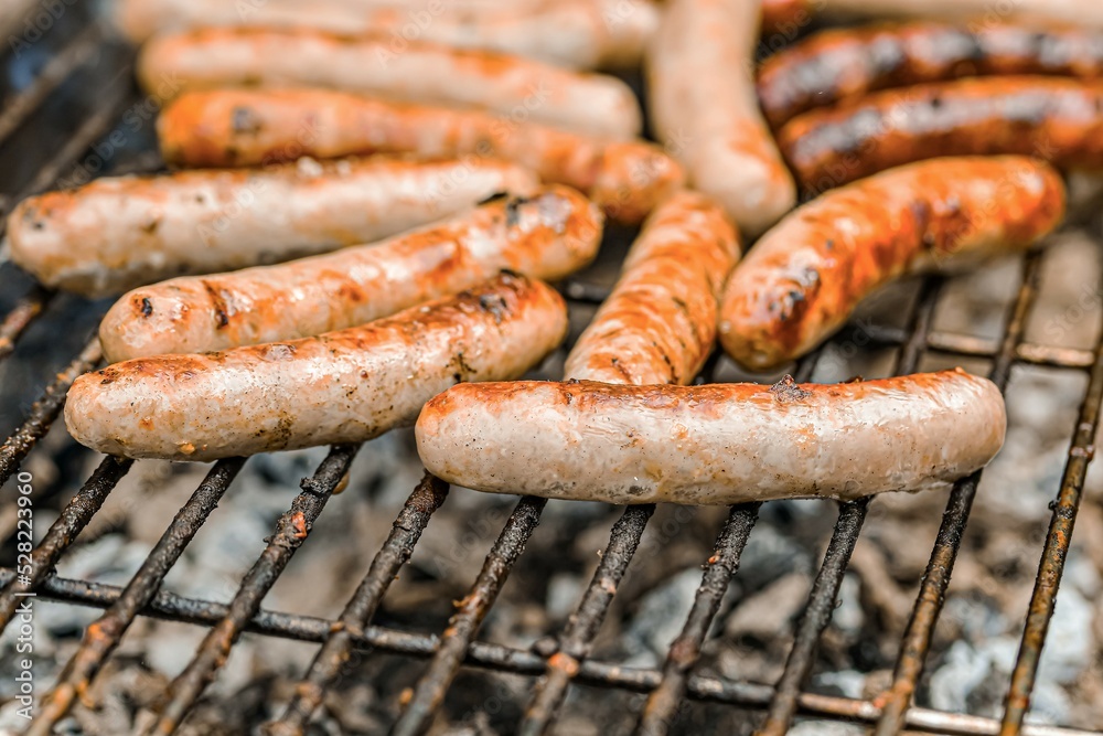 Grilled sausages on the fire are on the grill and are ready to eat.