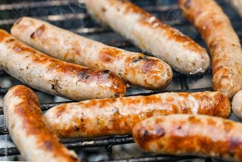 Grilled sausages on the fire are on the grill and are ready to eat.
