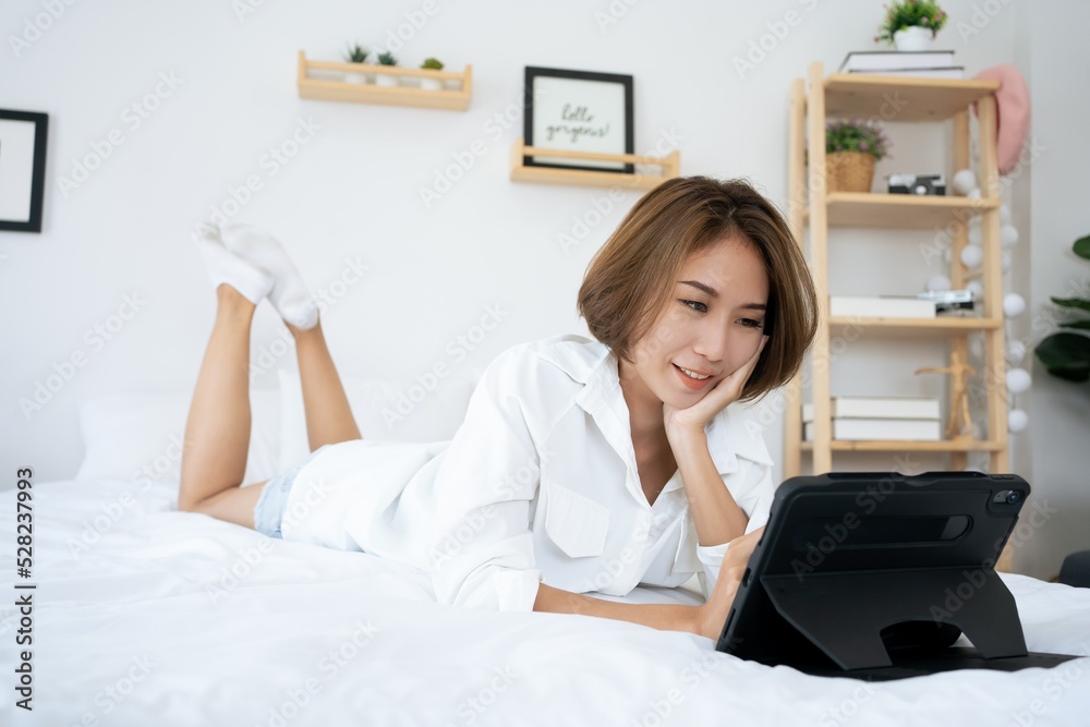 Stock Photo ID: 2196437789
Happy young woman with tablet pc laying on bed room. Young happy woman lie down on bed and playing smart tablet at home. Beautiful young women using tablet computer from ho Stock Photo ID: 2196437789
Happy young woman with tablet pc laying on bed room. Young happy woman lie down on bed and playing smart tablet at home. Beautiful young women using tablet computer from ho