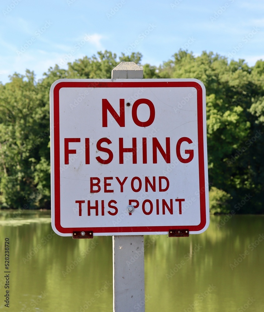 A close view of the no fishing sign at the lake.