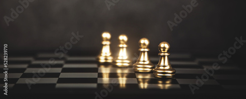 Chess standing in front of the line on chessboard concept of challenge or team player or business team and leadership strategy or strategic planning and human resources organization risk management.
