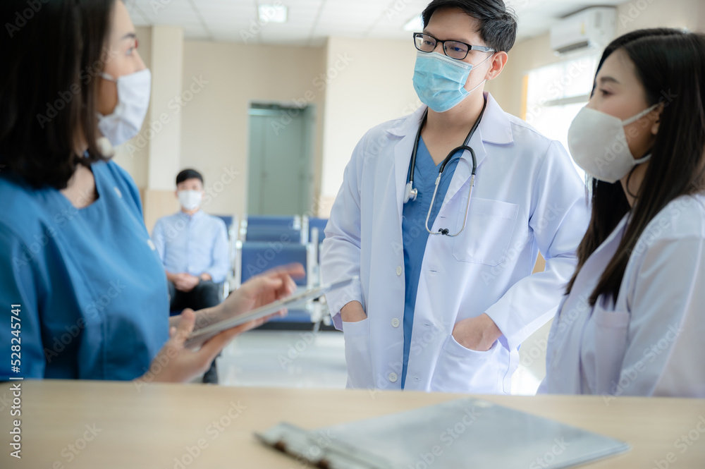 professional doctor and medicine person team have a conversation to talking in hospital about medical health care work, wearing surgical face mask