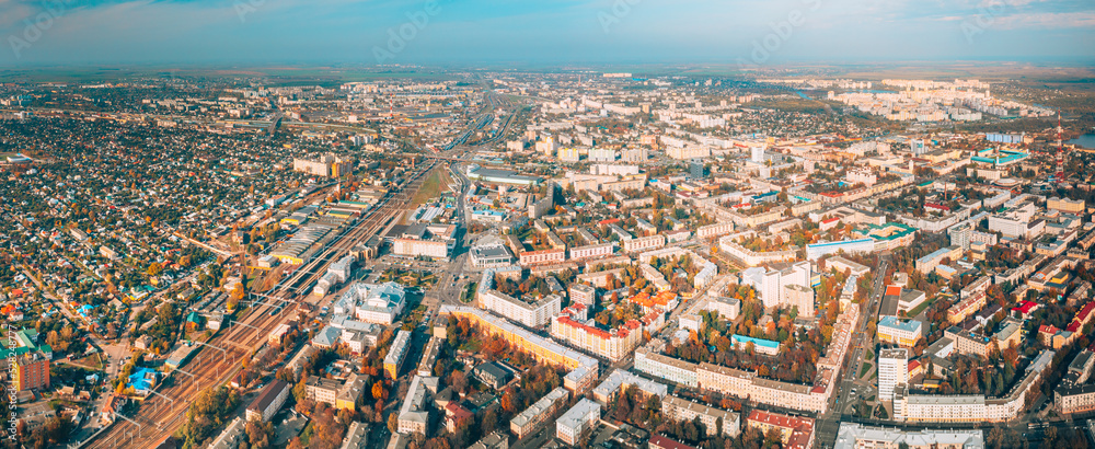 Aerial view of Homiel cityscape in autumn day. Bird's-eye view of railway station building and residential district. Gomel, Belarus. Panorama, panoramic view.