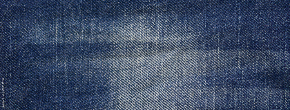 Photo of dark blue jeans fabric, detailed denim background, texture Photo of dark blue jeans fabric, detailed denim background, texture