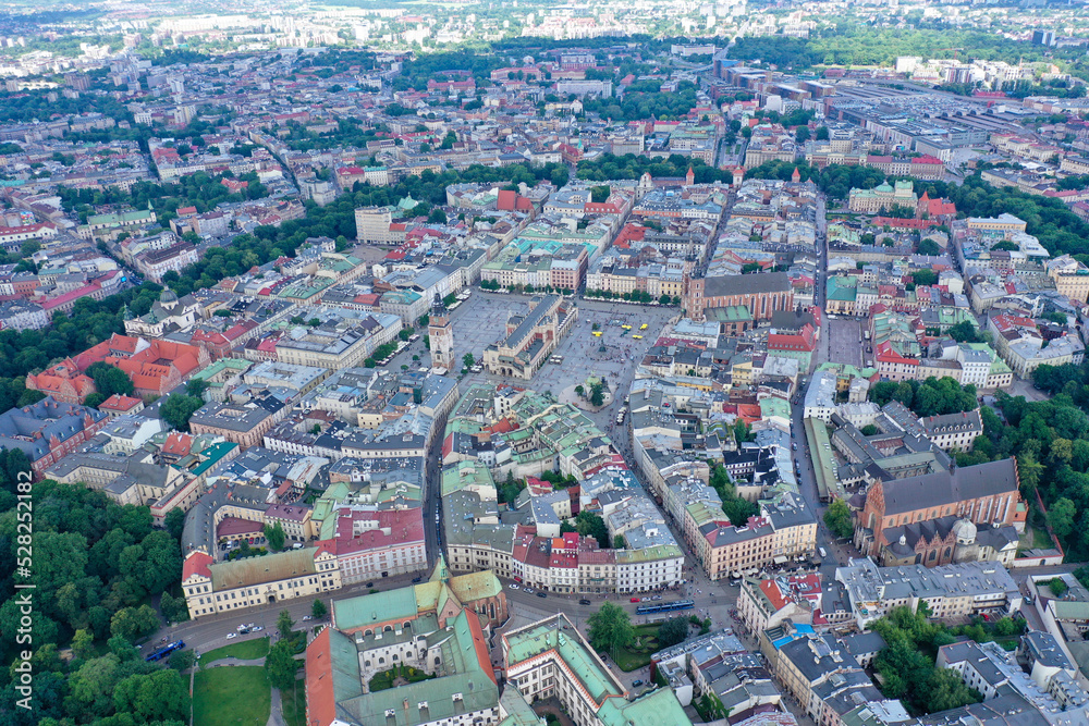 Aerial view of Krakow old town in the morning.  Main square and beautiful coloured buildings shown. 