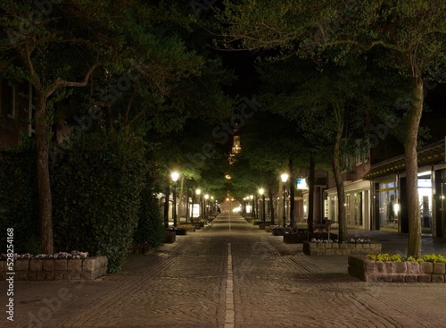 empty street of the old town with shops night © Yahor