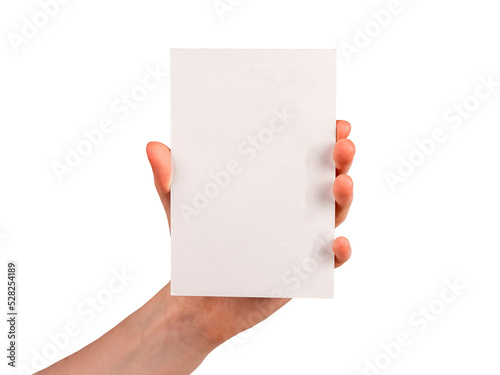 Hand holding postcard mockup isolated on white background. Template for congratulation, invitation, note. Paper in vertical position. photo