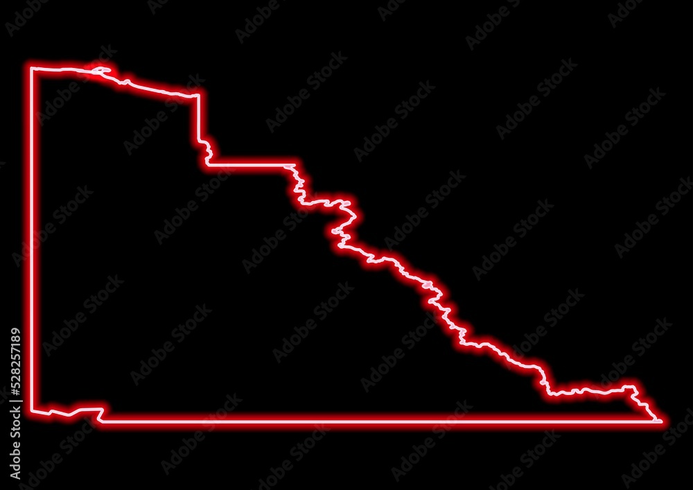 Red glowing neon map of Yukon Canada on black background.