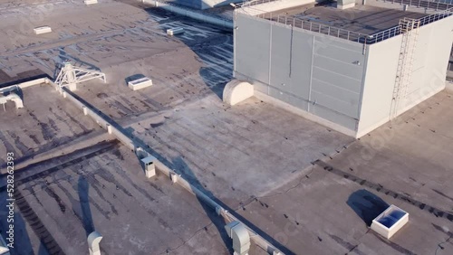 Aerial view of roof equipment and windows after rain.