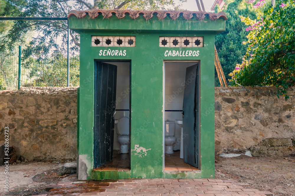 Old, open, public toilet in a park