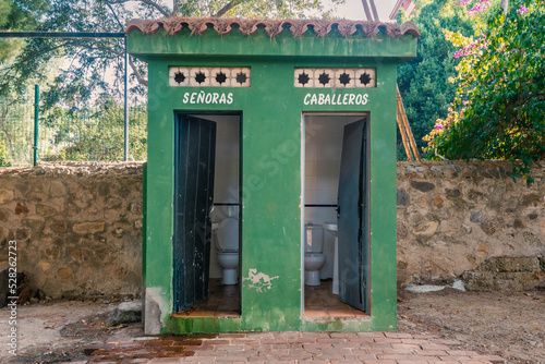 Old, open, public toilet in a park