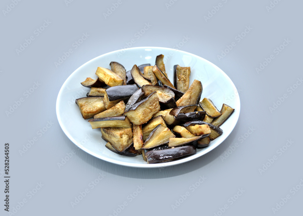 dish with baked eggplant on grey background dish with baked eggplant on grey background