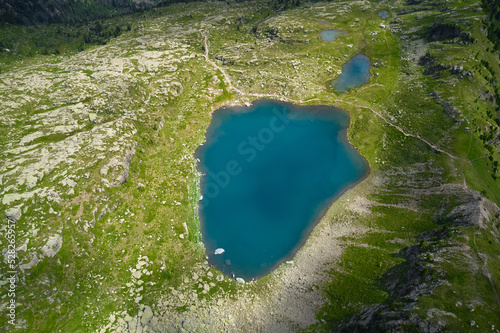 extended aerial view of the bombasel lake in trentino
