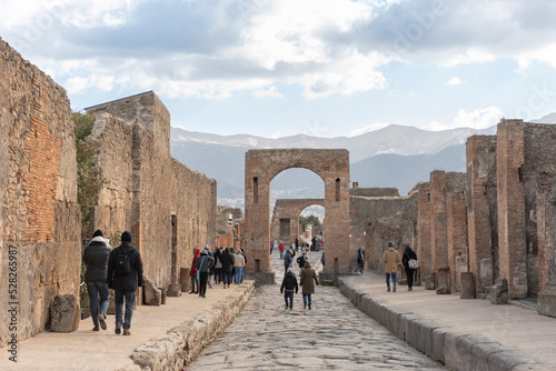 Fototapeta Naklejka Na Ścianę i Meble -  Ruins of the ancient city of Pompeii, ancient Roman city covered by the eruption of the volcano Vesuvius, Italy. Street in Pompeii