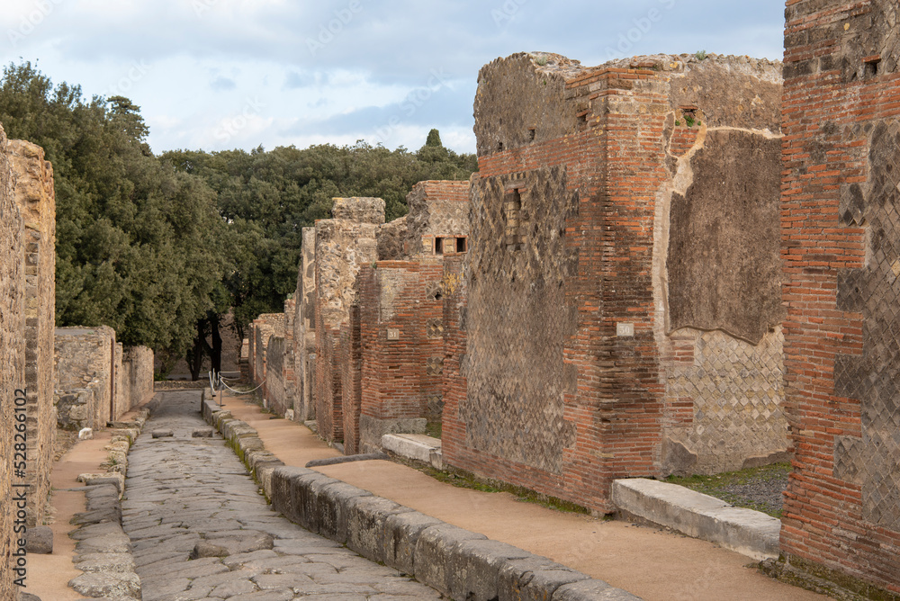 Ruins of the ancient city of Pompeii, ancient Roman city covered by the eruption of the volcano Vesuvius, Italy. Street in Pompeii