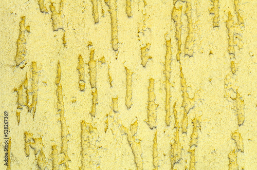 Yellow facade stucco background. Monolithic stucco decorative background. Silicate-cement plaster for walls. © Olena