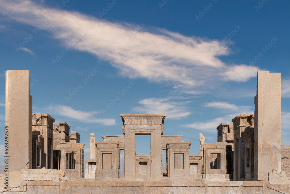 Sunrise in Persepolis, capital of the ancient Achaemenid kingdom. ancient columns. View of Iran. ancient persia. beautiful cloud background