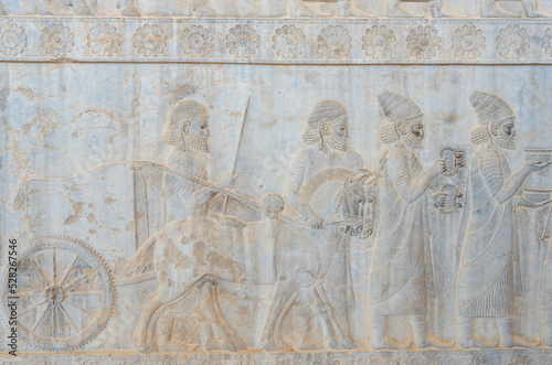 Bas-relief decoration along stairs from Darius palace to Palace of Xerxes. Ancient ruins of Persepolis near Shiraz in southern Iran. This UNESCO World Heritage Site showcases beautiful ruins from the 