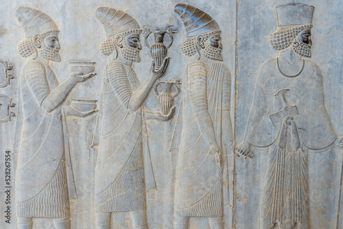 Bas-relief decoration along stairs from Darius palace to Palace of Xerxes. Ancient ruins of Persepolis near Shiraz in southern Iran. This UNESCO World Heritage Site showcases beautiful ruins from the 