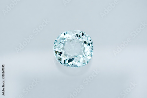Genuine light blue aquamarine gemstone setting ready for making jewelry. Loose  semiprecious  oval faceted  transparent gem on white background. Unheated  clean and sparkling. Gemology  mineralogy.
