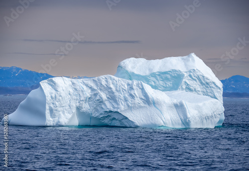 Navigating among gigantic icebergs along the Western coast of Greenland north of Paamiut