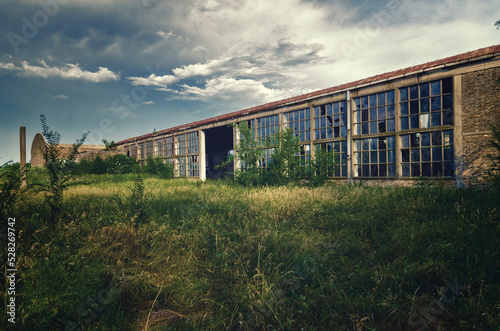 Abandoned factory building in summer 