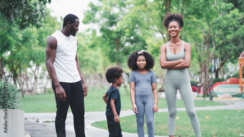African children and families happily play outdoor sports in the garden.Man jogging with nature in the garden.On summer vacation, the family happily took a walk in nature.