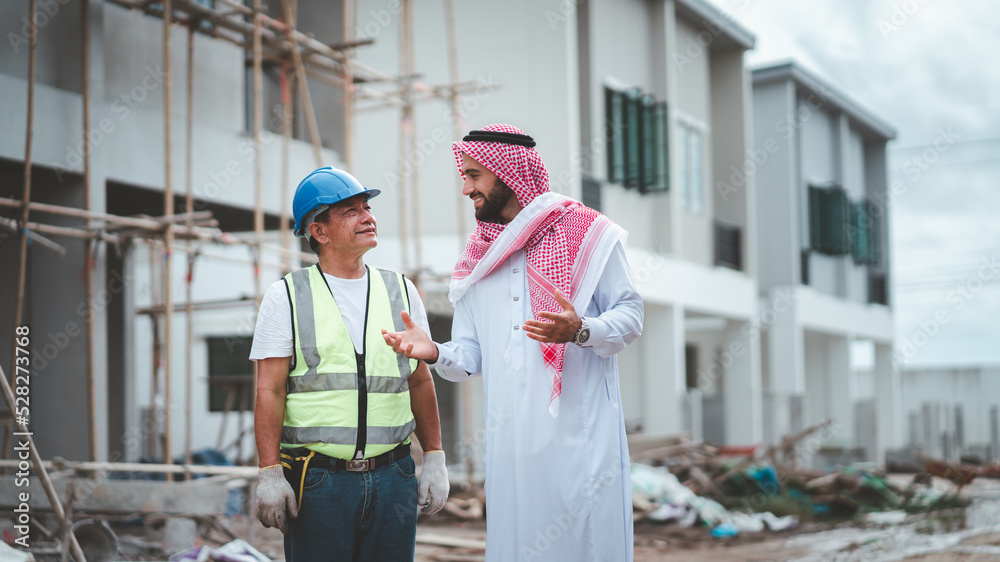 Arab Muslims are engaged in architecture business and are architects.Saudi manager organizes confidence meeting with partners. human achievement architecture construction site.