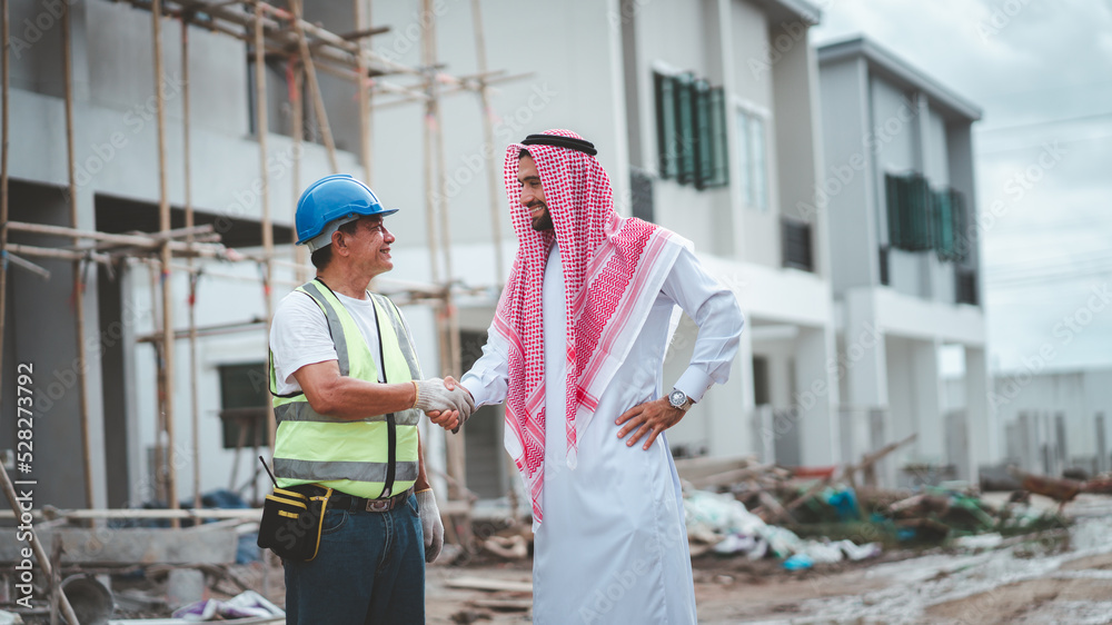 Arab Muslims are engaged in architecture business and are architects.Saudi manager organizes confidence meeting with partners. human achievement architecture construction site.