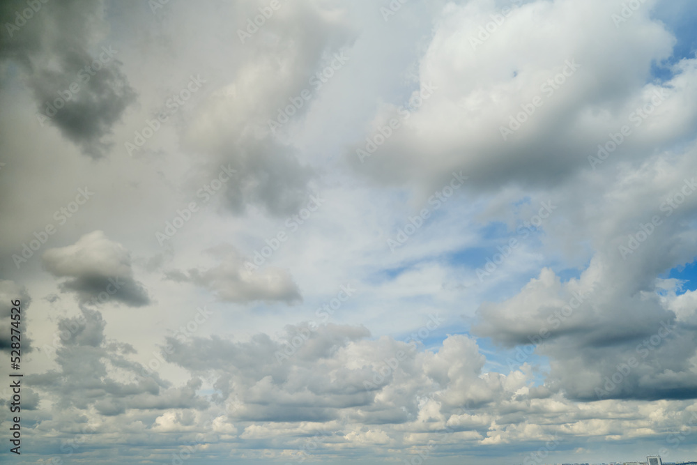 White cumulus clouds in the blue sky. Bright beautiful sky, copy space background White cumulus clouds in the blue sky. Bright beautiful sky, copy space background