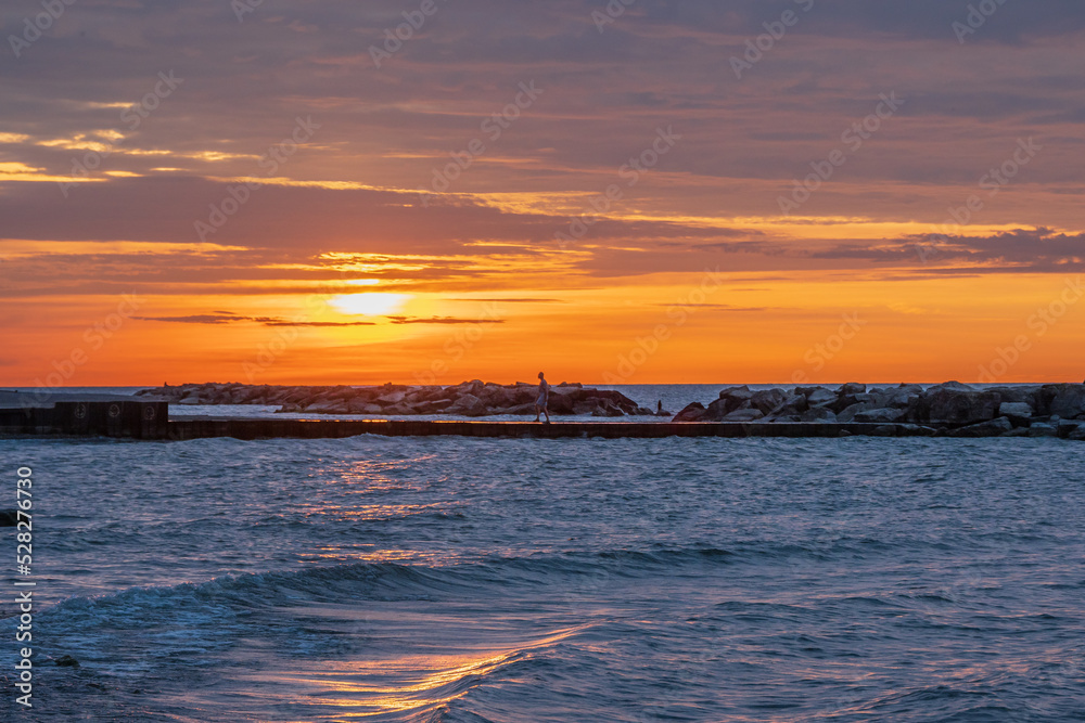 Naklejka premium The Boardwalk on Balmy Beach in Toronto at daybreak. Room for text