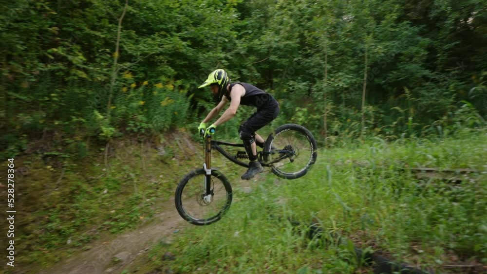 freeride in forest, MTB race and trial in nature, man is riding mountain bike, slow motion shot freeride in forest, MTB race and trial in nature, man is riding mountain bike, slow motion shot