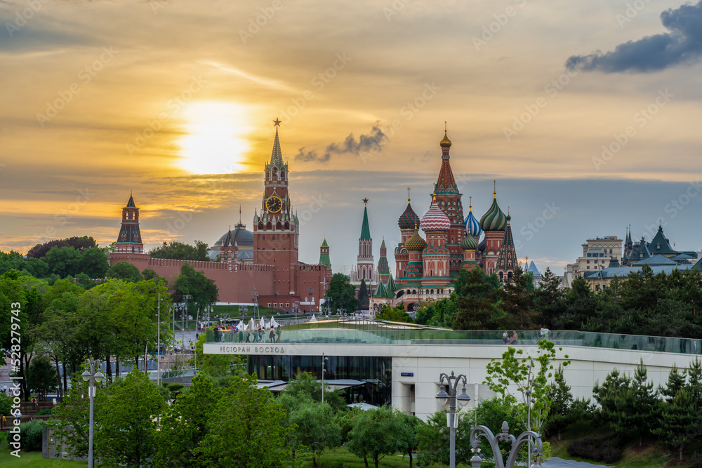 Fototapeta premium MOSCOW, RUSSIA - JUNE 2022: Moscow. View of Red Square with the Moscow Kremlin and St. Basil's Cathedral from park Zaryadye (Zaryadye inscription)