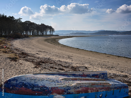 From Otter Ferry looking south west across Loch Fyne with a barnacle coverd upturned hull of a dinghy photo