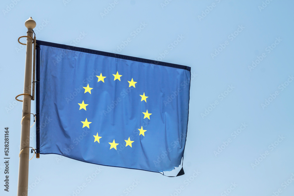 European Union Flag, Isolated on blue sky European Union Flag, Isolated on blue sky
