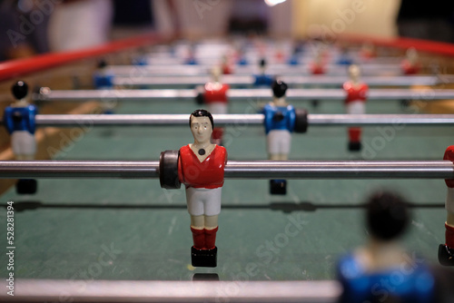 Figurine of an extra-long foosball table or table football © lensw0rld