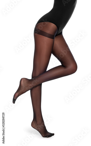 Woman wearing black tights on white background, closeup