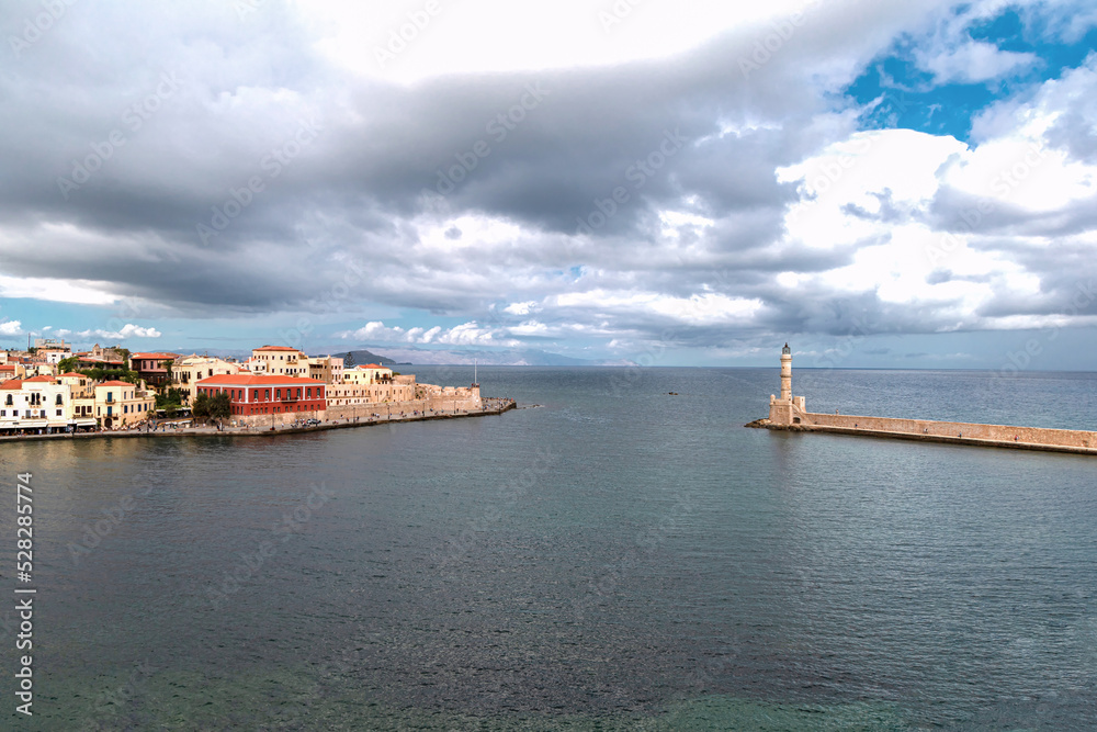 Landmarks of Crete - Panorama View of venetian port of Chania and lighthouse in old harbour of Chania, Greece. Landmarks of Crete - Panorama View of venetian port of Chania and lighthouse in old harbour of Chania, Greece.