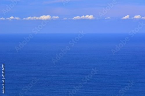 The immense Ocean merges with the sky on the horizon