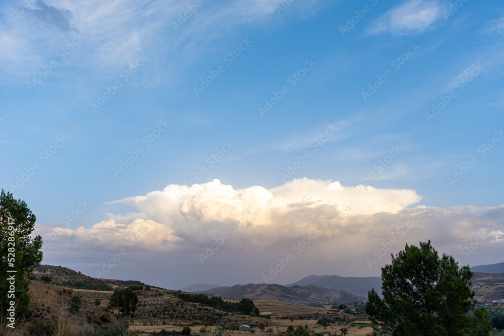 Cotton clouds over the village Cotton clouds over the village