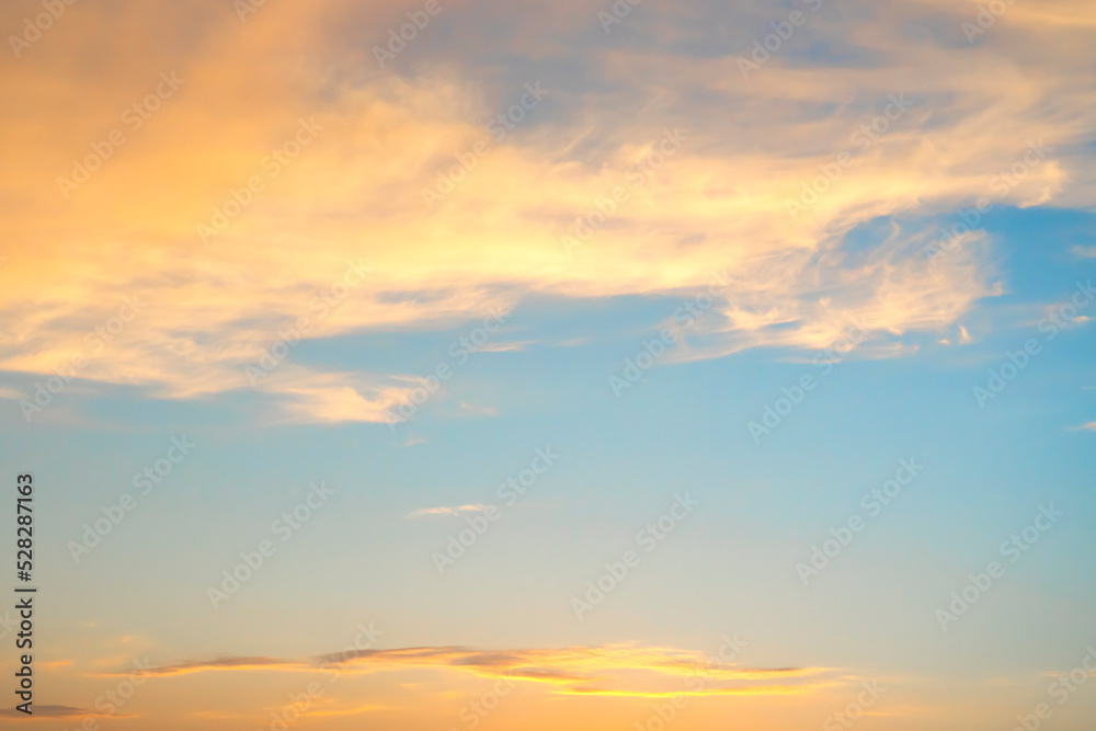 Beautiful orange clouds in the blue sky. Background for screen saver, wallpaper, cover. High quality photo