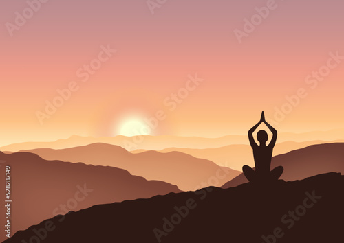 silhouette of a yoga person meditating on the sunsrise