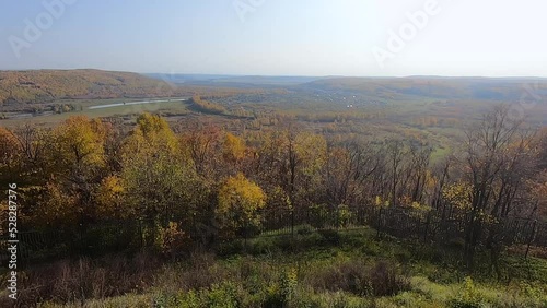 Top view of a beautiful autumn landscape with forest, mountains and river
