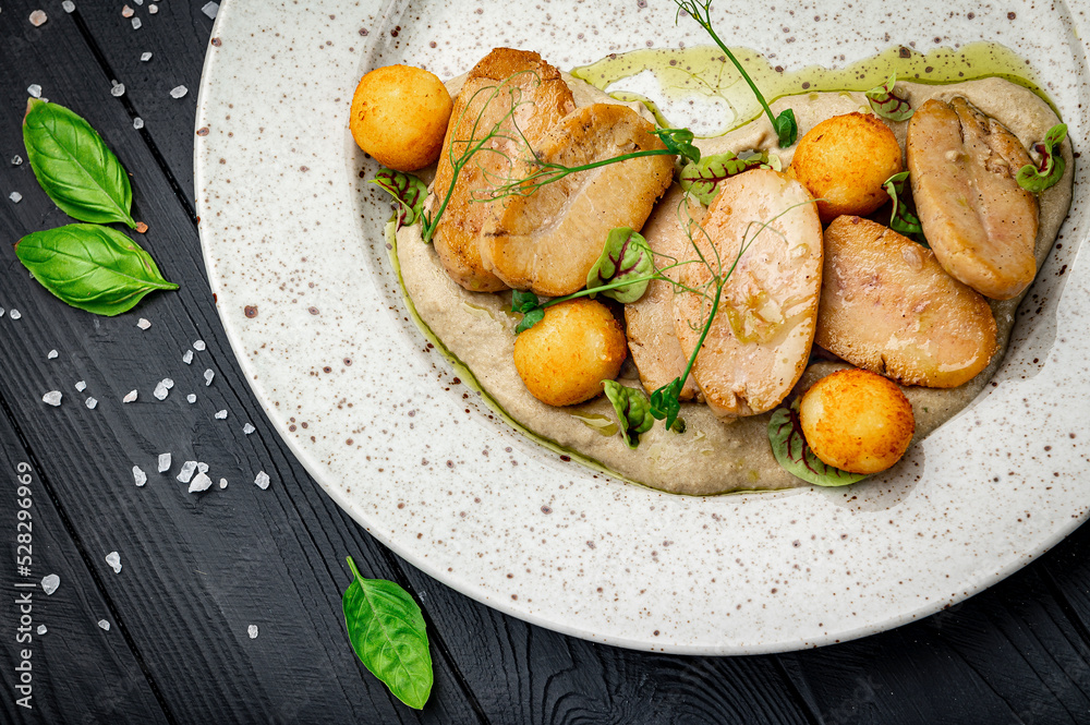 Fried bull testicles with potatoes and mushroom sauce. Fried bull testicles with potatoes and mushroom sauce.