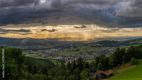 sunset over the fields in stormy clouds